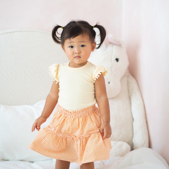 Resort Series - Girls Top with Pom Pom Sleeves in Peach