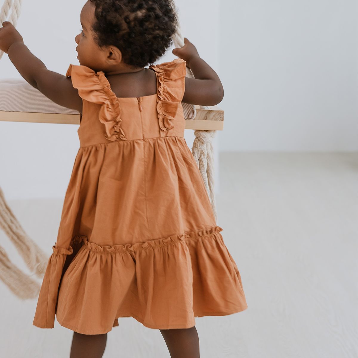 Girls Ruffled Baby Doll Dress in Caramel